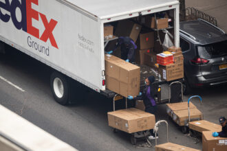 The image shows the back of the truck, which is open and boxes are visible everywhere