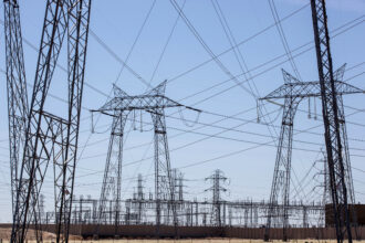 Regional grid operators are responsible for the reliability of the transmission networks. Many operators hold auctions to pay power producers and energy efficiency aggregators, like American Efficient, to balance the supply and demand of electricity. Credit: George Rose/Getty Images