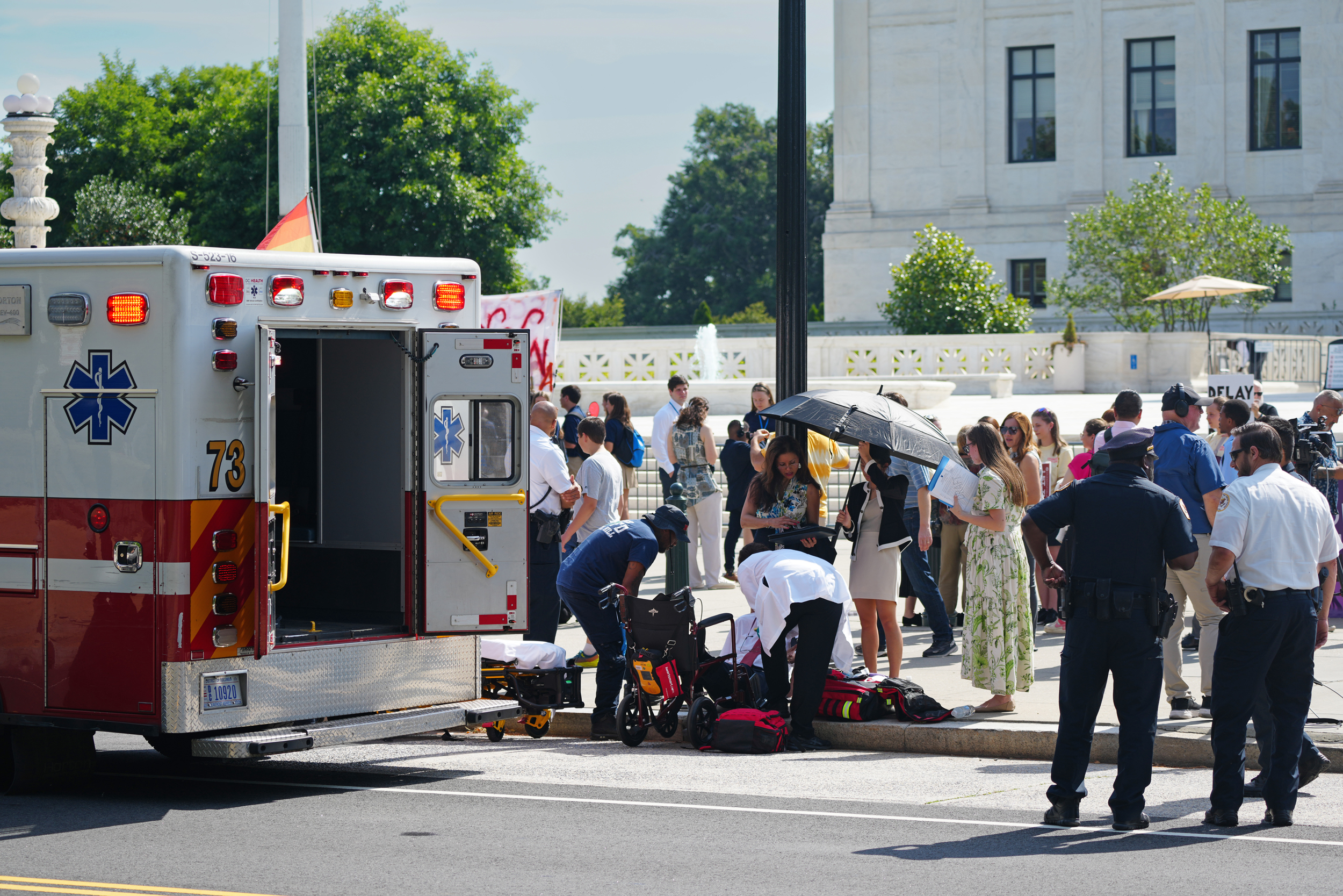 Paramedics treat a person who fainted in front of the Supreme Court on June 20, 2024, as temperatures reached more than 90 degrees Fahrenheit in Washington, D.C. Credit: Andrew Leyden/NurPhoto via Getty Images