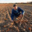 Al Krupski, owner of Krupski Farms in Peconic, N.Y., holds dry soil in one of his pumpkin fields on Nov. 19, 2024, as Long Island undergoes a three-month drought. Credit: Steve Pfost/Newsday RM via Getty Images