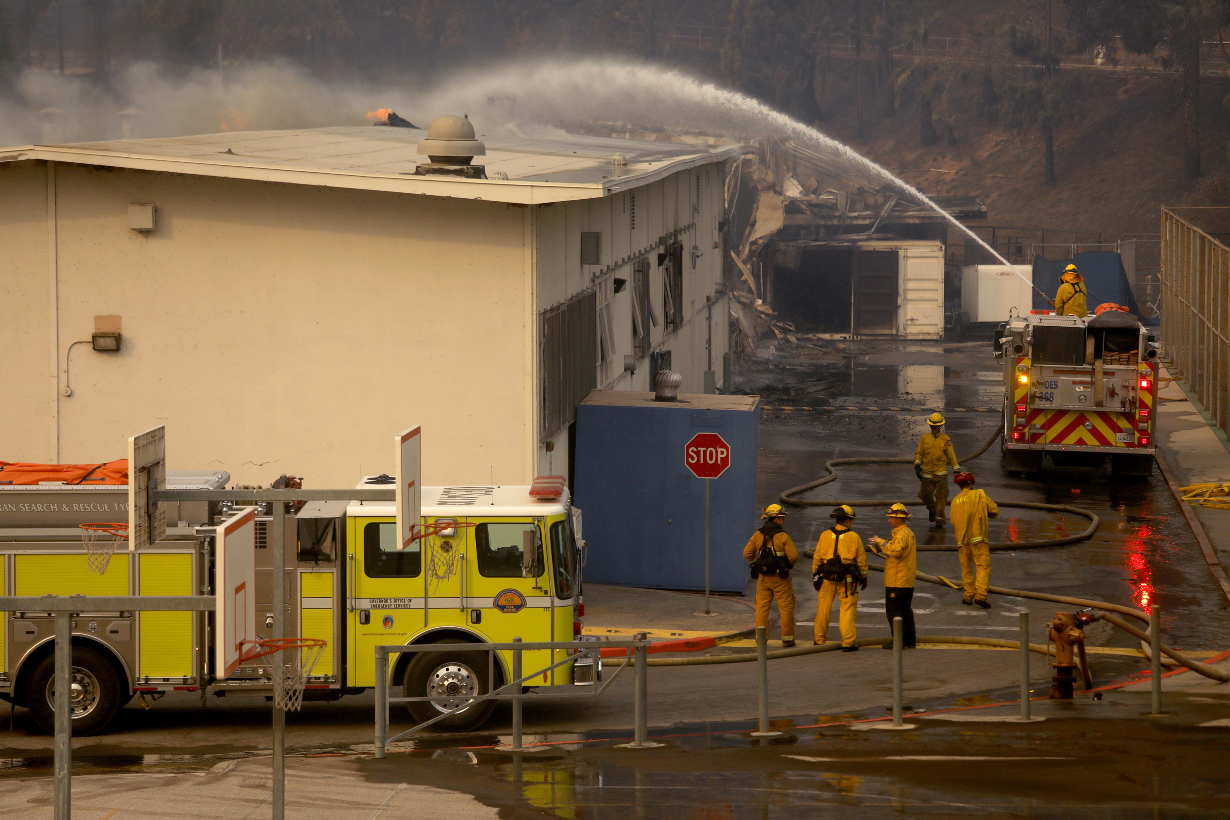 Firefighters put out a hot spot on Palisades Charter High School as multiple wildfires spread throughout Los Angeles on Jan. 7. Credit: Genaro Molina/Los Angeles Times via Getty Images