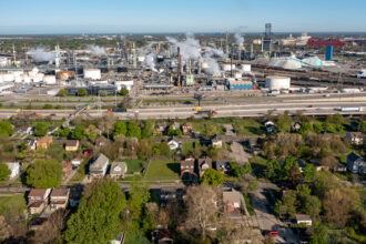 A low-income neighborhood is seen near an oil refinery in southwest Detroit. Credit: Jim West/UCG/Universal Images Group via Getty Images