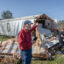 Volunteers help Tim Striegel clean up after his mobile home was hit by a tornado on March 16 in Calera, Ala. Credit: Jan Sonnenmair/Getty Images
