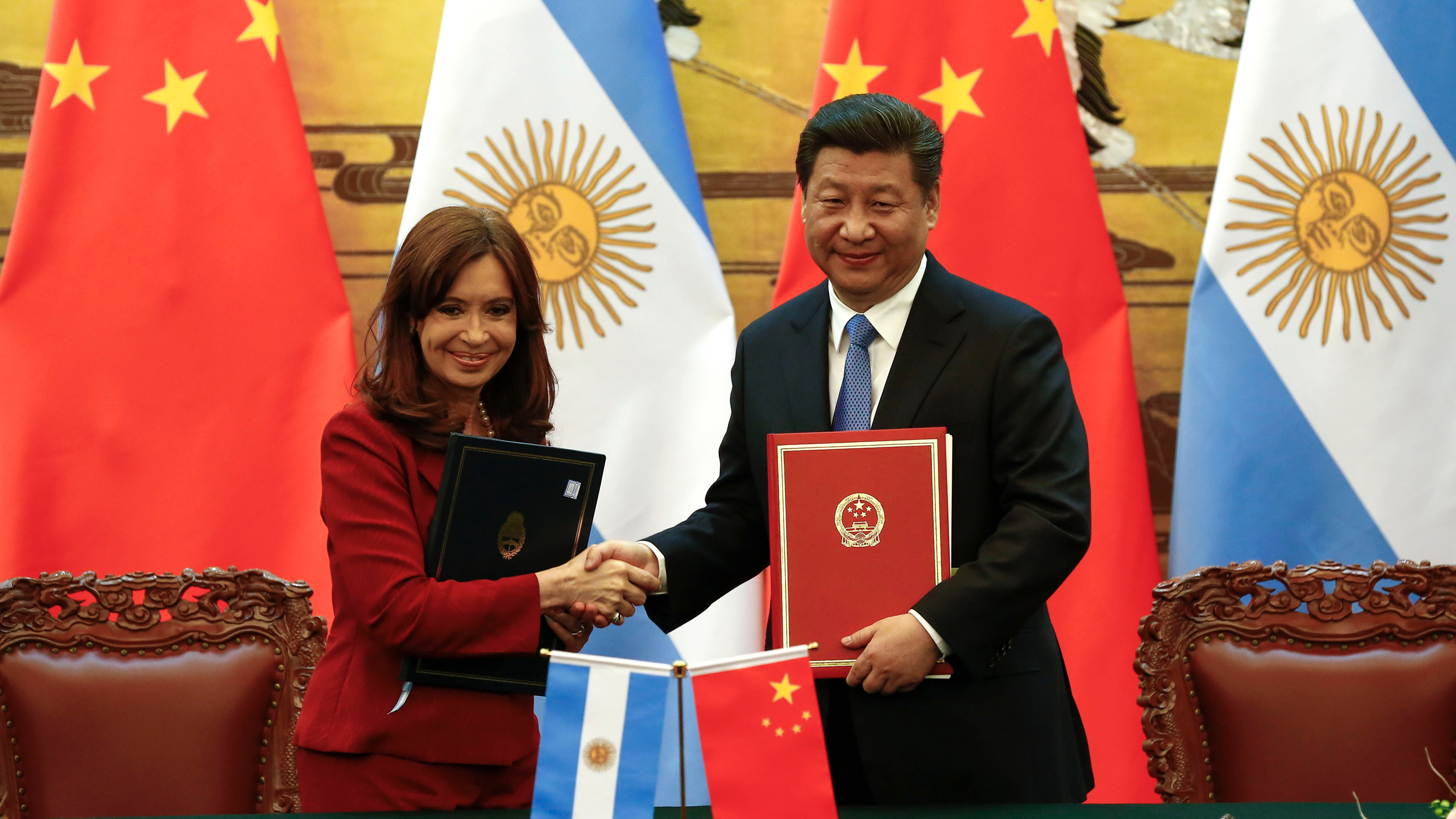 Argentinian President Cristina Fernandez de Kirchner (left) and Chinese President Xi Jinping shake hands after signing documents during a ceremony at the Great Hall of the People on Feb. 4, 2015 in Beijing, China. Credit: Rolex dela Pena/Getty Images