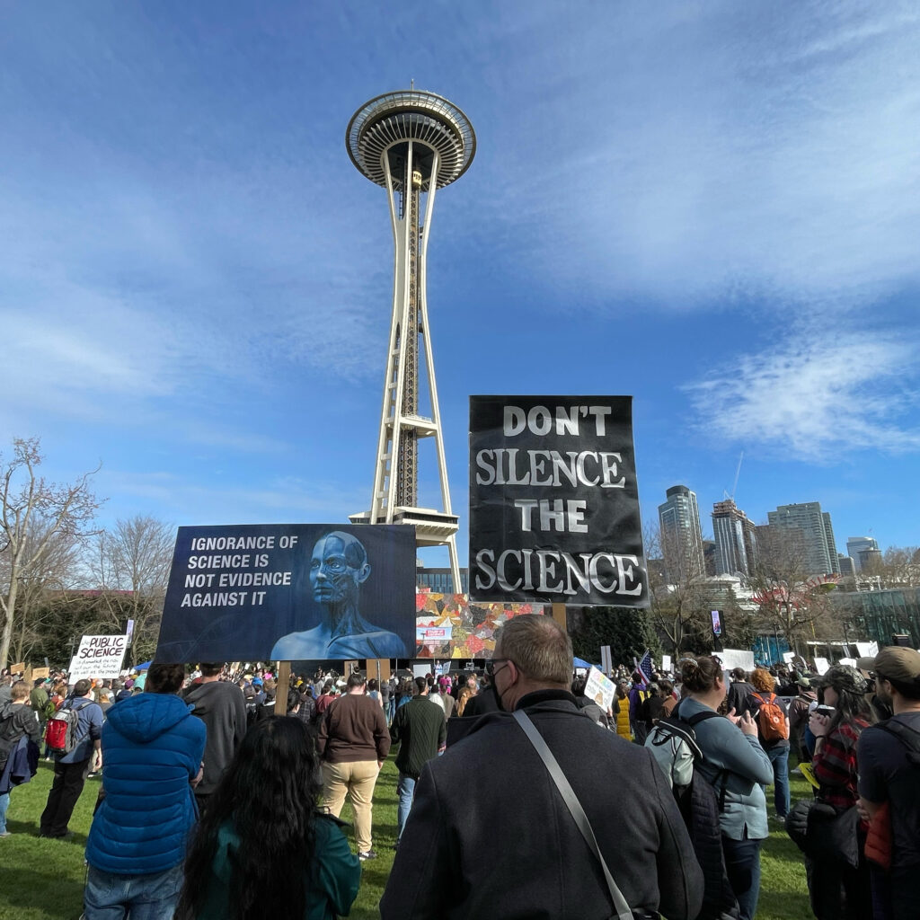 Scientists and their supporters gather near the Space Needle at a Stand Up for Science rally in Seattle. Credit: Bryn Nelson