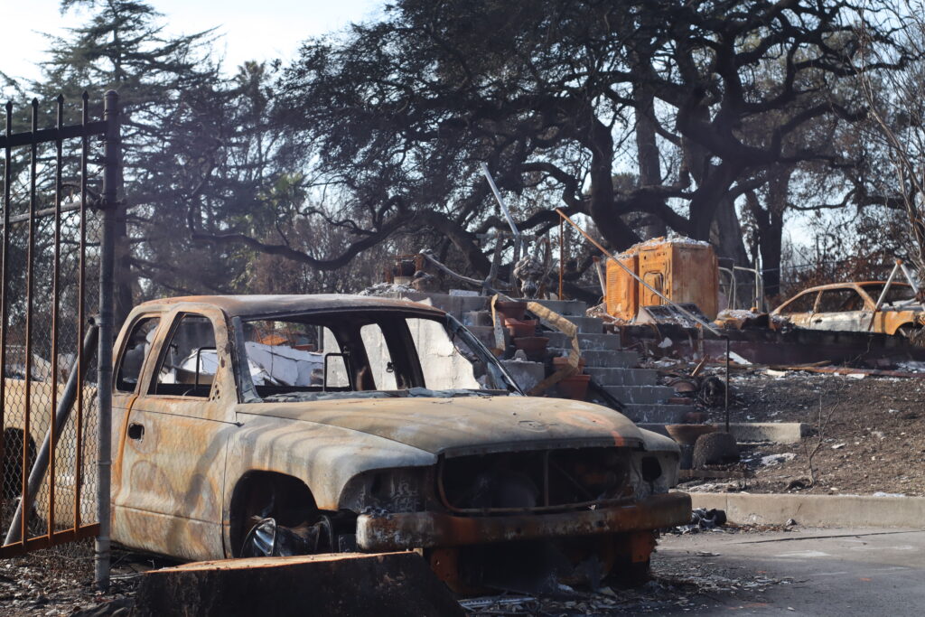 Burnt cars and paint contribute to the toxic smoke that damaged homes in California. Credit: Rambo Talabong/Inside Climate News