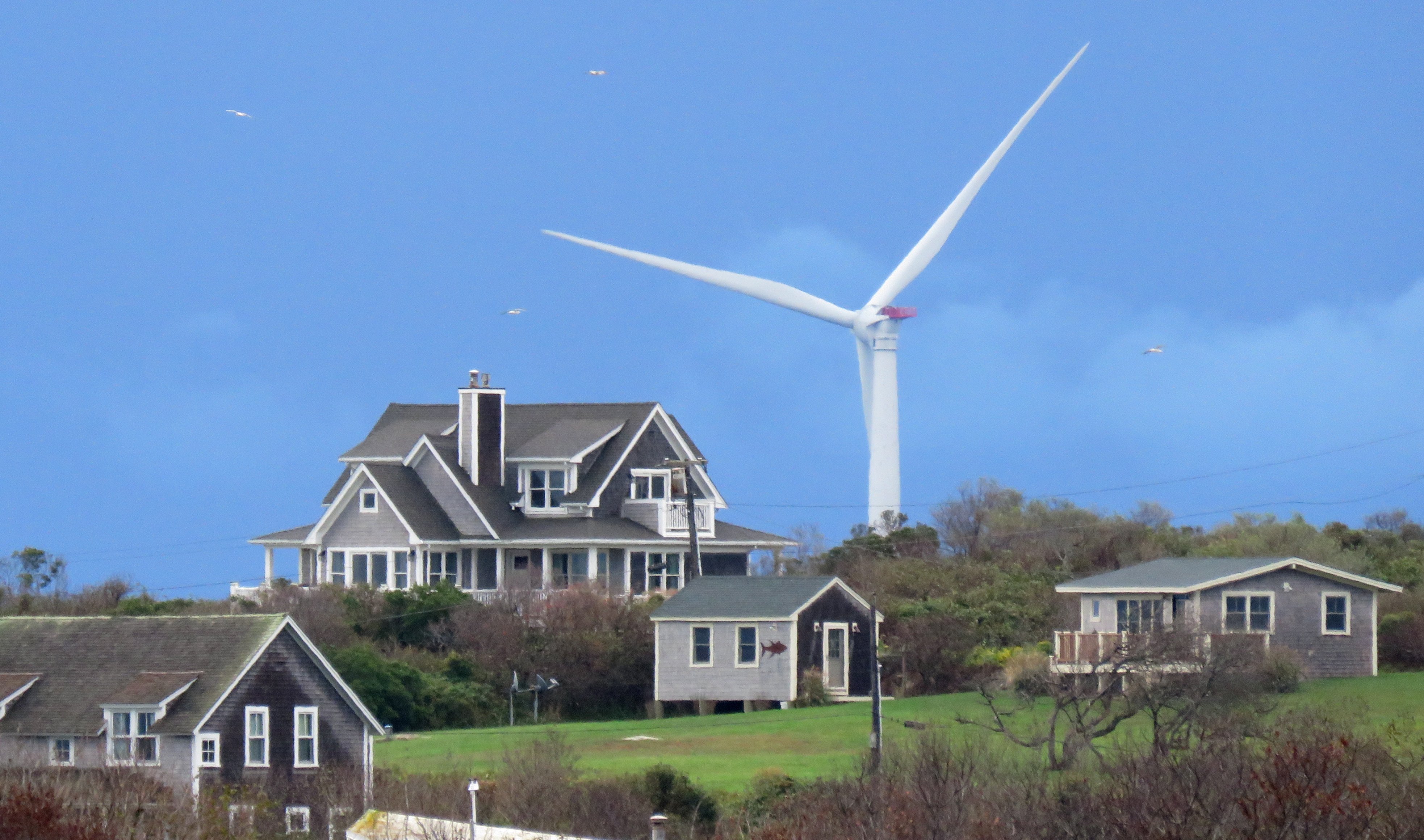 Deepwater Wind, regulated by the Rhode Island Public Utilities Commission, was the nation's first offshore wind farm, as seen from Block Island. Credit: Mark Harrington/Newsday RM via Getty Images.