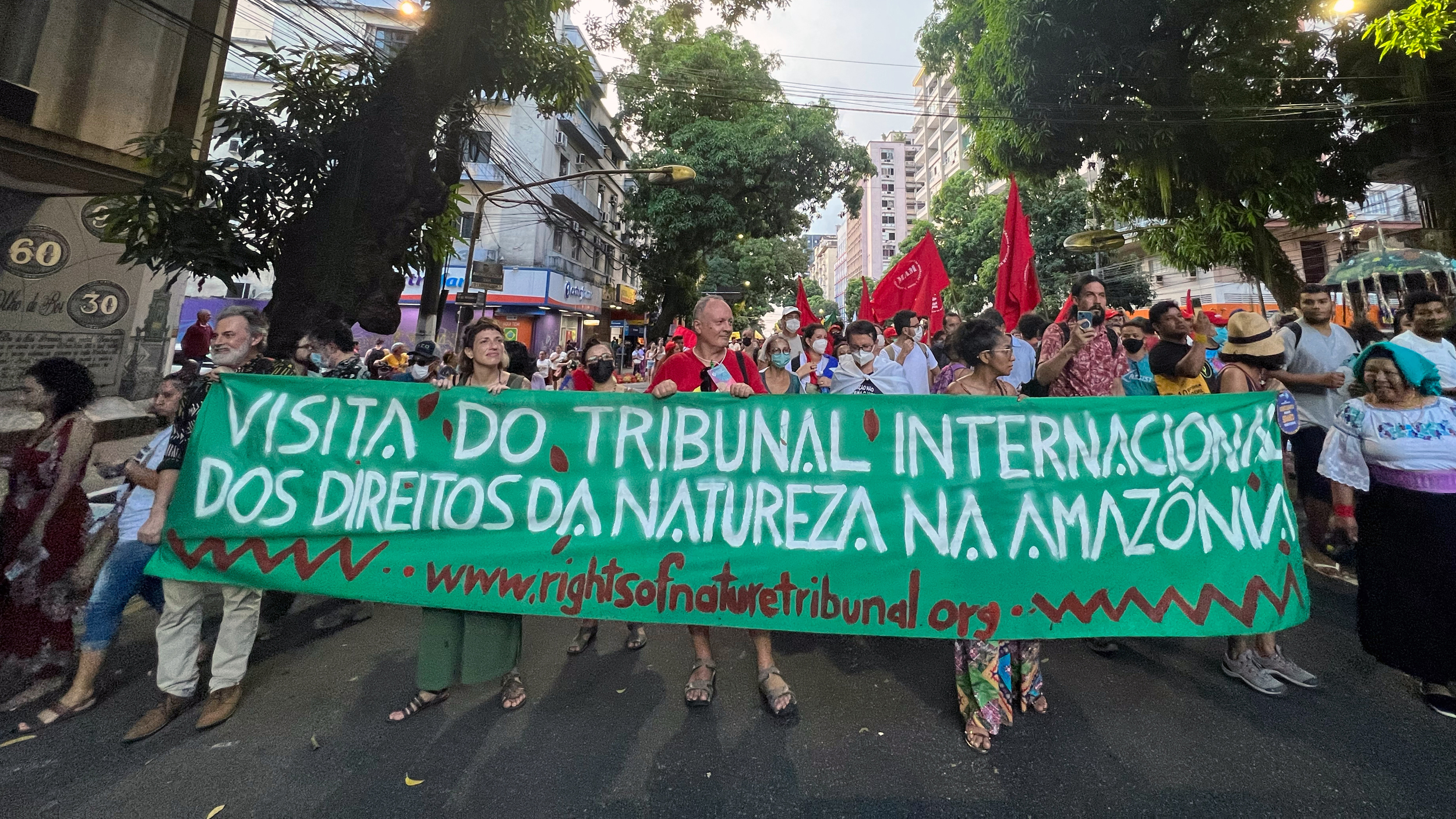 Members of the International Rights of Nature Tribunal march in Belém, Brazil, during the 2022 Pan-Amazonian Social Forum. The Tribunal investigates alleged violations of nature's rights. Credit: Katie Surma/Inside Climate News