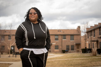 Cheryl Johnson stands near the office of People for Community Recovery in Altgeld Gardens. Credit: Zubaer Khan/Chicago Sun-Times
