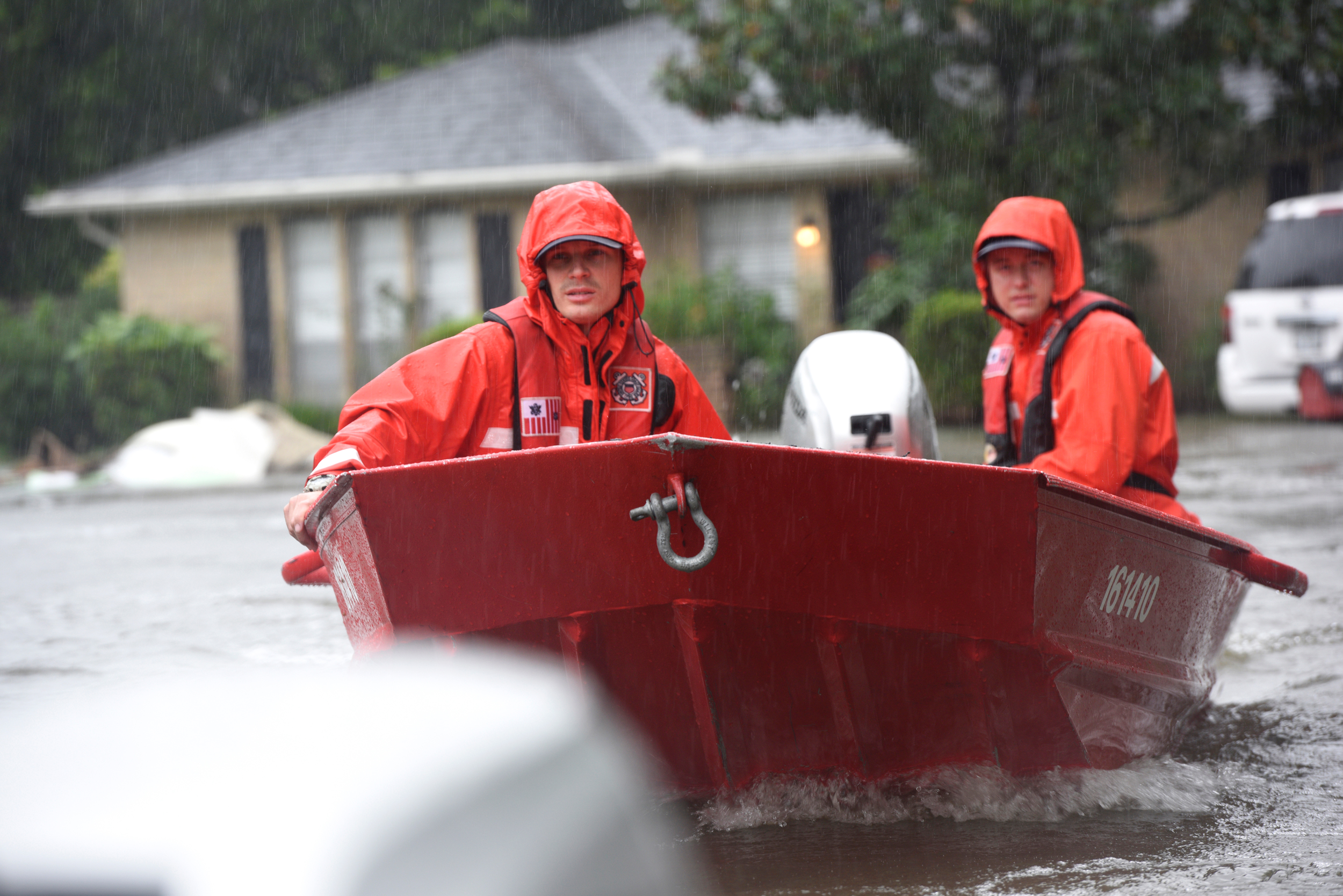 In the wake of Hurricane Harvey, Coast Guard officers pilot a 16-foot flood punt boat while checking for residents of a flooded neighborhood in Friendswood, Texas, in August 2017. Credit: Corinne Zilnicki/U.S. Coast Guard