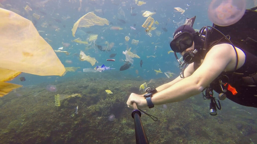 A still from “Single-Use Planet” shows the plastic pollution invading the tropical waters of Bali, Indonesia.