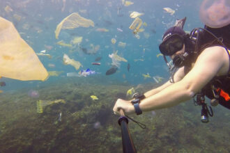 A still from “Single-Use Planet” shows the plastic pollution invading the tropical waters of Bali, Indonesia.
