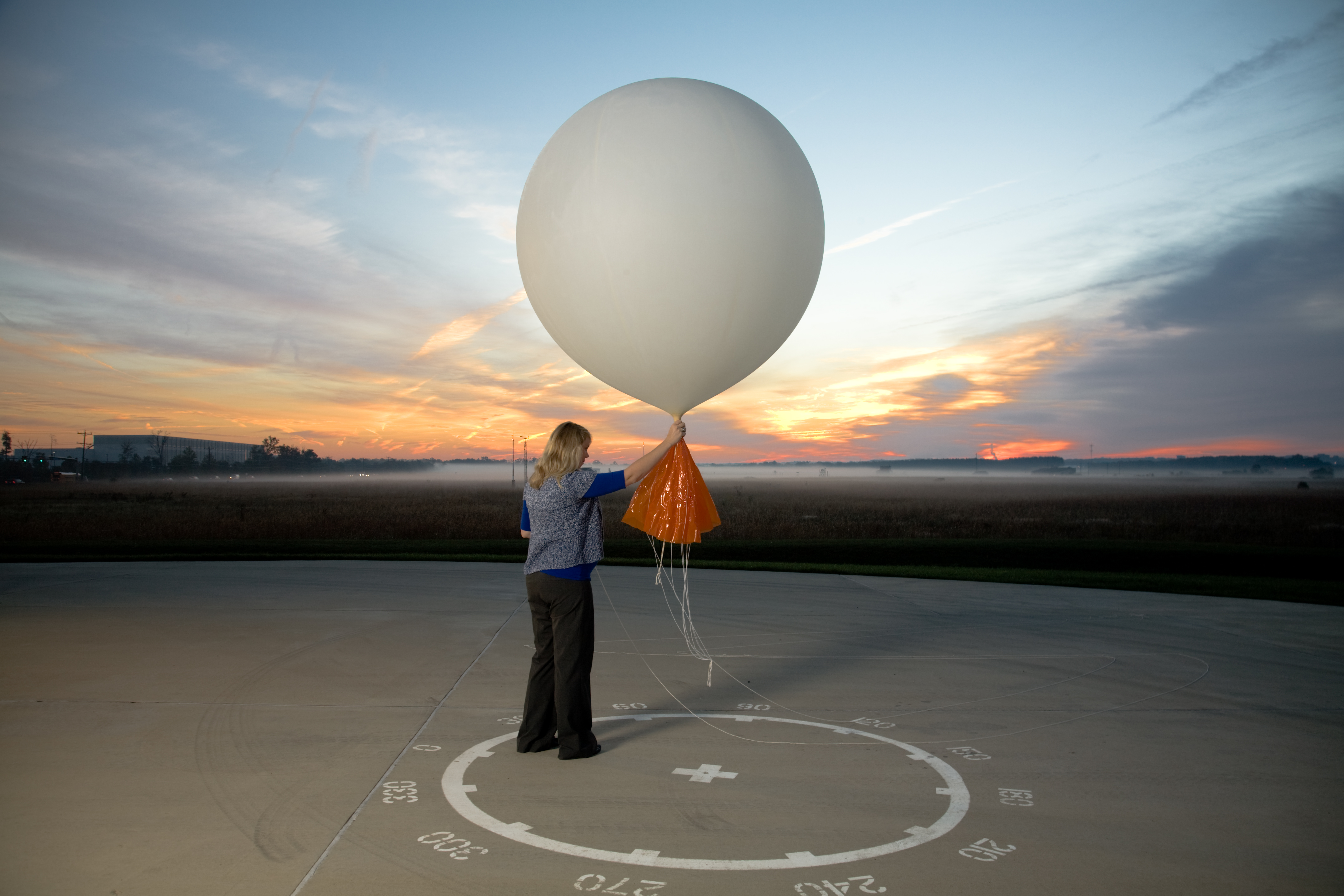 A meteorologist prepares to release a weather balloon at National Weather Service Headquarters in Sterling, Va. Credit: Benjamin C. Tankersley/The Washington Post via Getty Images