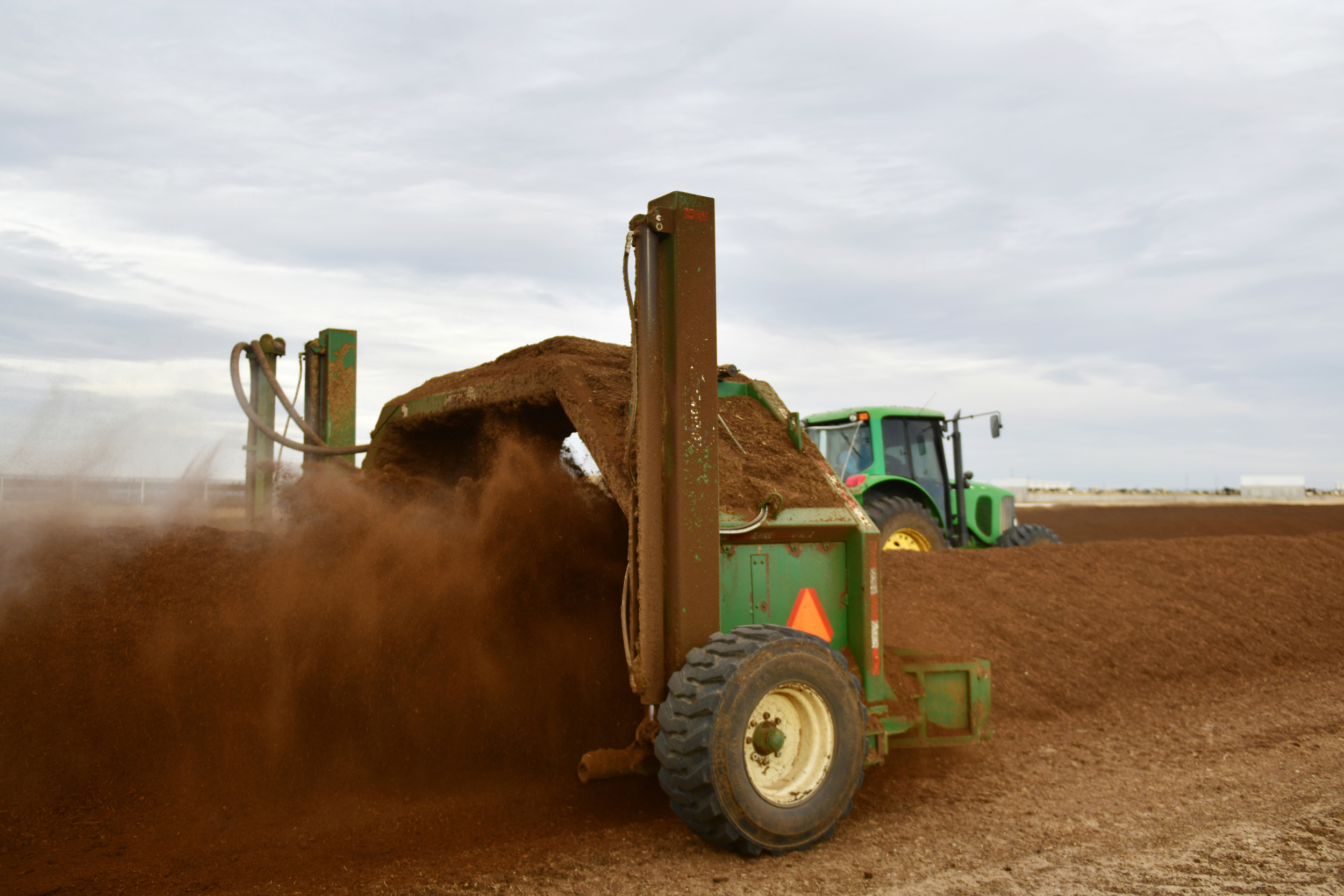 A tractor pulls a machine for composting cow manure at a dairy farm in Fort Morgan, Colo. Credit: Hyoung Chang/The Denver Post via Getty Images