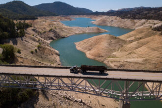 Dry land is exposed on the banks of the Lake Oroville reservoir due to low water levels during the California drought emergency on May 25, 2021, in Oroville, Calif. Credit: Patrick T. Fallon/AFP via Getty Images