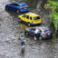 People check on a car stuck in a flooded street on June 13, 2024, in Hallandale Beach, Fla., a community that was marked as disadvantaged by the Climate and Economic Justice Screening Tool. Credit: Joe Raedle/Getty Images