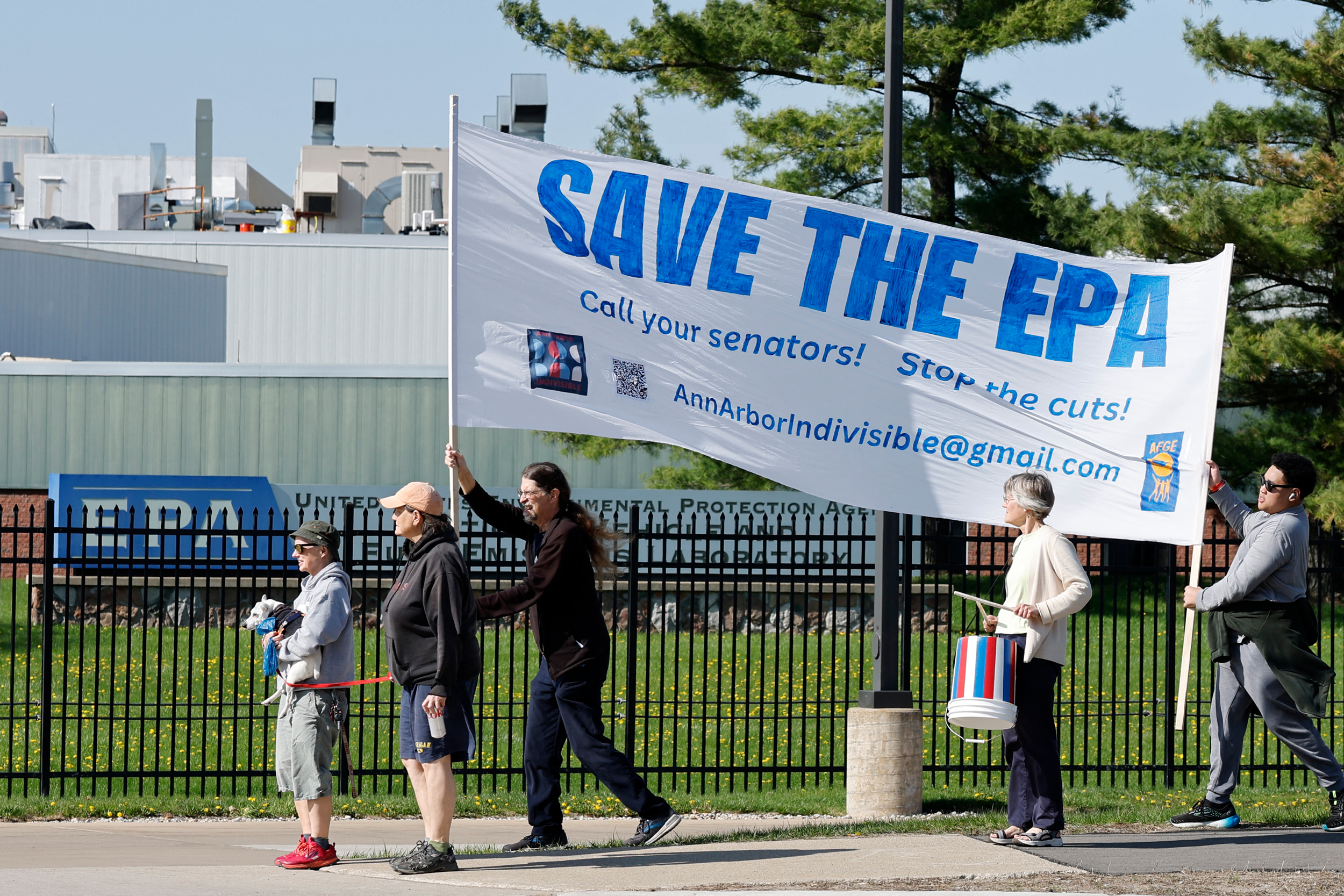 Demonstrators march during a rally outside the EPA offices on Tuesday in Ann Arbor, Mich. Credit: Jeff Kowalsky/AFP via Getty Images