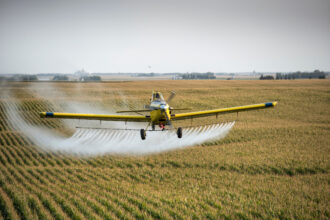 An Air Tractor sprays pesticides on a farm in Whittemore, Iowa. Charles Ommanney/The Washington Post via Getty Images