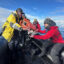 Tudor Morgan, with HX Expeditions, passes a recording device called a SoundTrap to Heidi Ahonen, a bioacoustician who has launched the first long-term project to monitor whales in the Gerlache Strait using passive acoustic monitoring. Credit: Teresa Tomassoni/Inside Climate News