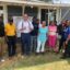 Sierra Club Executive Director Ben Jealous (center, in white) poses with Dr. Robert Bullard (to his left, in yellow), Pastor Timothy Williams and other members of the Shiloh community in south Alabama. Credit: Courtesy of Living on Earth