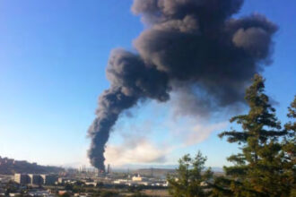 A cracked pipe at Chevron’s oil refinery in Richmond, Calif., released a flammable white vapor that quickly ignited, sending a large cloud of black smoke across surrounding communities on Aug. 6, 2012. The eruption led to stricter state safety rules for refineries, but now officials are considering rolling back some of those provisions. Credit: U.S. Chemical Safety Board