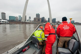 USGS scientists take streamflow measurements along the Mississippi River in St. Louis. This information is critical in making flood predictions and response plans. Credit: Jennifer LaVista/USGS