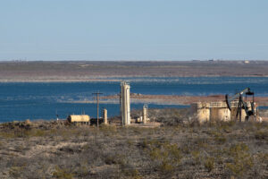 An oil drilling operation on the banks of the Red Bluff Reservoir in Reeves County, Texas is seen on May 27, 2020. Credit: Justin Hamel