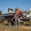 Diane Wilson pictured by her skiff outside her Calhoun County home in December 2024. Credit: Dylan Baddour/Inside Climate News