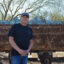 Hector Denogean Sr. stands the Mammoth Miners Memorial in Southern Arizona. Denogean says he can’t support a new mine that may take more water out of the drying region. Credit: Wyatt Myskow/Inside Climate News