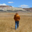 Patrick Donnelly, the Great Basin director for the Center for Biological Diversity, walks through an alkaline meadow in Fish Lake Valley on May 6. The valley used to be home to a series of streams and lakes that once provided habitat for fish like the Fish Lake Valley tui chub. Credit: Wyatt Myskow/Inside Climate News