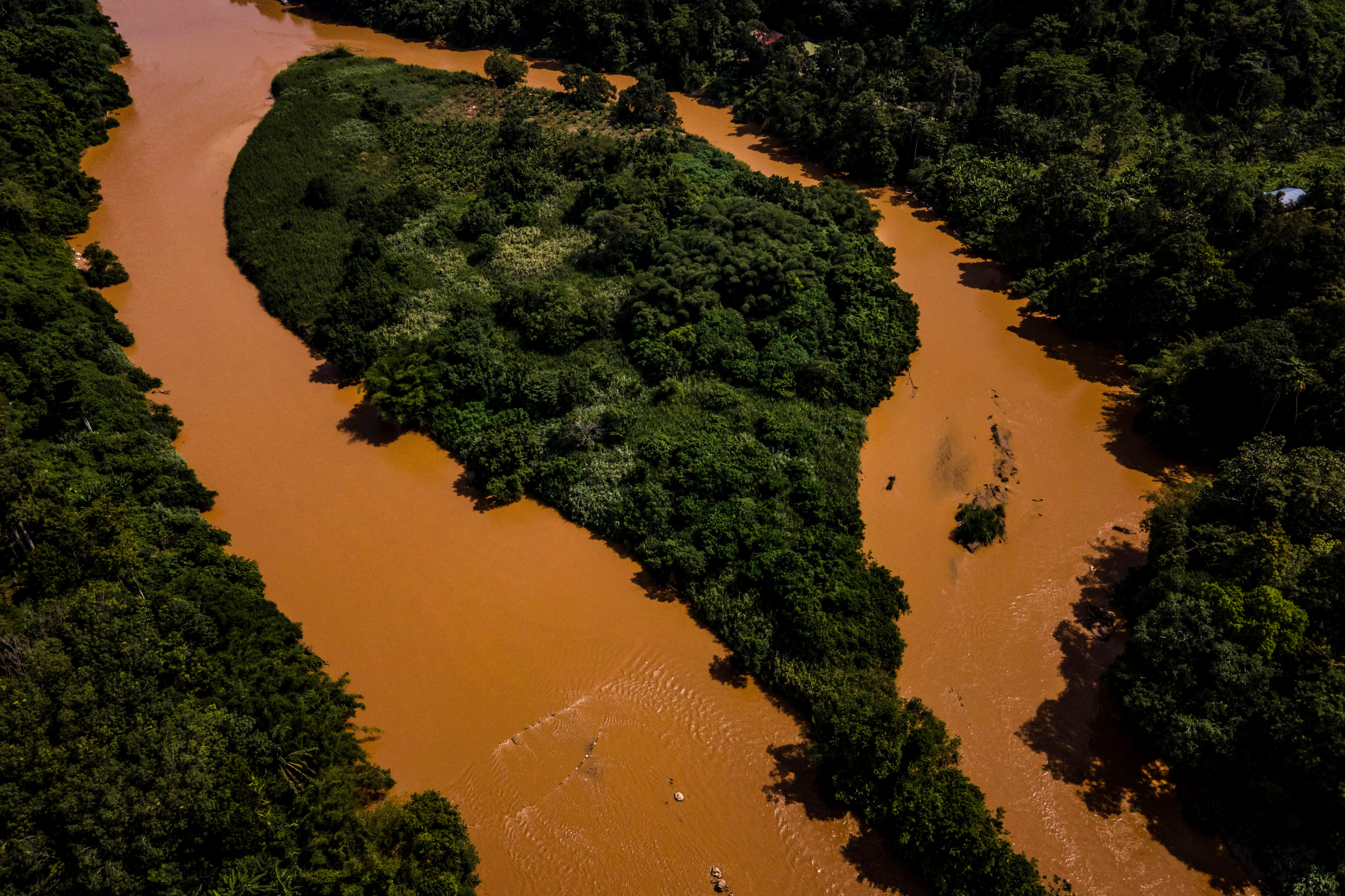 The Betis River runs orange with soil washed down from the intense logging conducted in Temiar territory.