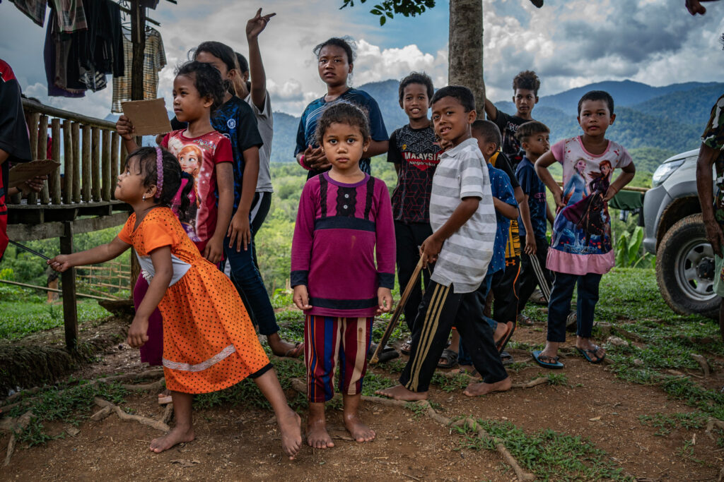 The children of Pos Pasik are told to stay in the village because a tiger can still be heard howling at night in the surrounding area.