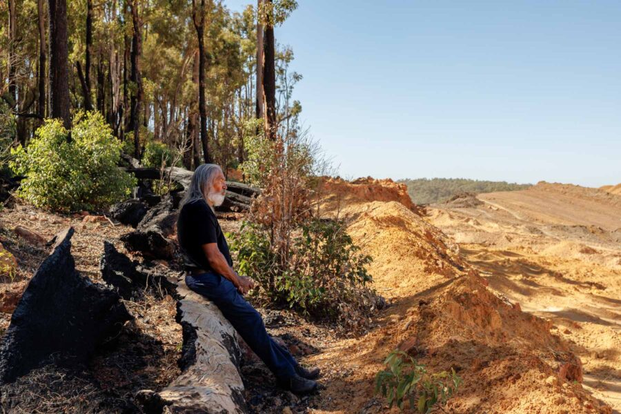 George Walley, a Noongar elder, sits at the edge of an Alcoa mine site near Jarrahdale in Western Australia on March 24. Credit: Quinn Glabicki/PublicSource