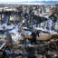 A family walks through what remains of their grandfather’s house in a neighborhood decimated by the Marshall Fire on Jan. 2, 2022, in Louisville, Colo. Credit: Michael Ciaglo/Getty Images