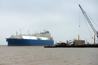 An LNG tanker makes its way into Cameron Pass near the site of Venture Global’s Calcasieu Pass project in southwest Louisiana. Credit: The Washington Post via Getty Images
