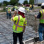 A construction worker takes a sip of water during a heat wave while repairing a road that was damaged from the heat in Houston, Texas on June 27, 2023. Credit: Mark Felix/AFP via Getty Images