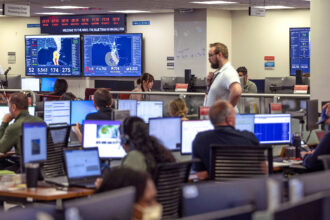 Technicians monitor Hurricane Ian inside the National Response Coordination Center at the FEMA headquarters, on Sept. 28, 2022, in Washington, D.C. Credit: Kevin Dietsch/Getty Images