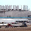Traffic on Interstate 90 drives by the shuttered Belvidere Assembly Plant in Belvidere, Ill. The United Auto Workers announced in April that Stellantis would not go forward with a battery plant it planned to add to the giant facility. Credit: Photo by Scott Olson/Getty Images