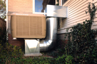 A swamp cooler is attached to a house in Denver, Colo. Credit: Cyrus McCrimmon/The Denver Post via Getty Images