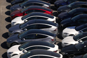 New cars sit parked at a Tesla dealership in Corte Madera, Calif. Credit: Justin Sullivan/Getty Images