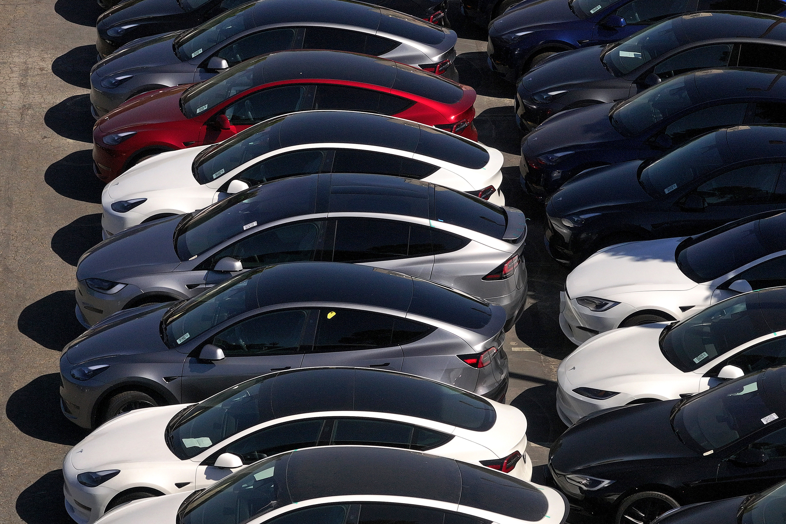 New cars sit parked at a Tesla dealership in Corte Madera, Calif. Credit: Justin Sullivan/Getty Images