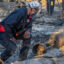 A member of the FEMA Urban Search and Rescue team searches the ruins of a home destroyed by the Eaton Fire on Jan. 11 in Altadena, Calif. Credit: David McNew/Getty Images