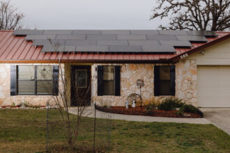 Solar panels are seen on the roof of a home on Feb. 14, in Bandera, Texas. Credit: Christopher Lee/Houston Chronicle via Getty Images