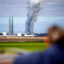 A bystander watches a fire burn at the Vistra Corp. battery storage plant on Jan. 17 in Moss Landing, Calif. Credit: Doug Duran/Digital First Media/East Bay Times via Getty Images