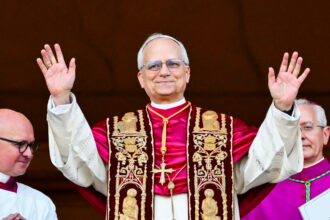Newly elected Pope Leo XIV arrives on the central balcony of Saint Peter’s Basilica for the first time after the cardinals ended the conclave in the Vatican on May 8. Credit: Alberto Pizzoli/AFP via Getty Images