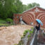 Chaz Netzer and his son Jaxson, 8, watch the deluge of water gathering up at the Calvary Christian Academy as flash flood warnings are in effect on May 13 in Cresaptown, M.D. Credit: Ricky Carioti/The Washington Post via Getty Images