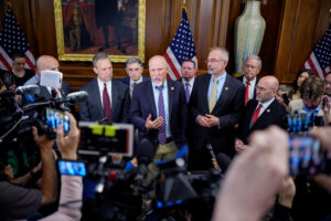 From left: Reps. Scott Perry (R-Pa.), Andrew Clyde (R-Ga.), Chip Roy (R-Texas), Eric Burlison (R-Mo.), Andy Harris (R-Md.), Ralph Norman (R-S.C.) and Clay Higgins (R-La.) talk to the press about ongoing negotiations over the "One, Big, Beautiful Bill" at the Capitol Building on May 21. Credit: Andrew Harnik/Getty Images