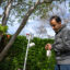 Parham Azimi, a Harvard University researcher, checks an outdoor air monitor which has been collecting samples for the last week outside Nicole Bryne’s house on April 1 in Pasadena, Calif. Credit: Nina Dietz/Inside Climate News