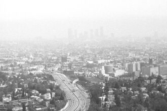 A blanket of smog covers downtown Los Angeles as seen from Mulholland Drive in 1984. Credit: UCLA Library, Los Angeles Times Photographic Collection