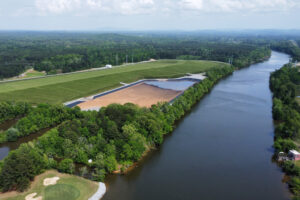 A covered coal ash pond sits adjacent to the Coosa River in Gadsden, Ala. Credit: Courtesy of Coosa Riverkeeper